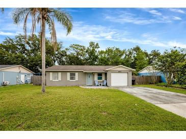Charming single-story home with a well-maintained lawn and a welcoming front entrance at 2943 Slippery Rock Ave, Orlando, FL 32826