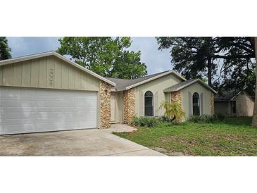 Charming single-Gathering home with a two-car garage and stone accents at 2008 Juniper Dr, Edgewater, FL 32141