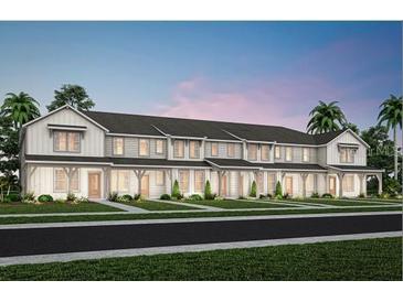 Beautiful new construction townhomes featuring an attractive facade with covered porches and lush landscaping at 11429 Nona Sound St, Orlando, FL 32832