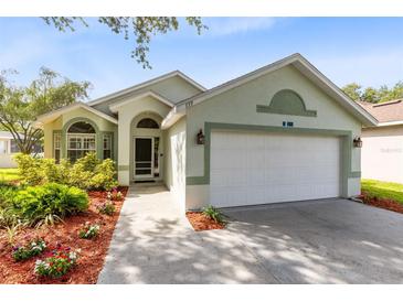 Charming single-story home with well-maintained landscaping and a two-car garage at 139 Andrews Rd, Sanford, FL 32773