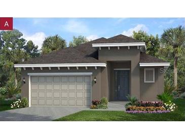 Charming one-story home with a neutral color palette, attached two-car garage, and tropical landscaping at 2276 Sirena Ln, Mount Dora, FL 32757