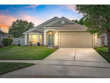 Charming single-Gathering home featuring a well-manicured lawn and a two-car garage at 2913 Wilshire Rd, Clermont, FL 34714