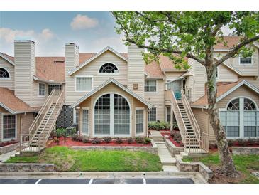 Inviting two-story condo featuring unique architectural design and well-maintained landscaping at 620 Glenwood Ct # 79, Altamonte Springs, FL 32714