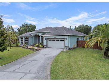 Charming single-story home with a well-manicured lawn, inviting curb appeal and mature trees at 19232 Somerset St, Orlando, FL 32833