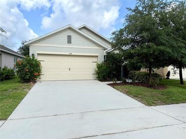 Charming single-story home with a well-maintained lawn and a two-car garage, perfect for Gathering living at 324 Charles Dr, Deland, FL 32724