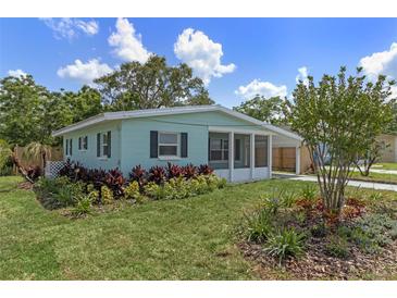 Charming single-story home with lush landscaping and inviting curb appeal at 588 Highway 630 E, Frostproof, FL 33843