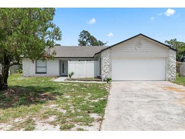 Charming single-story home with a spacious two-car garage and partially xeriscaped front yard at 3187 Shady Willow Dr, Orlando, FL 32808