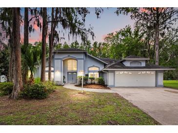 Charming single Gathering home with lush landscaping and a two-car garage at 4026 S Lake Orlando Pkwy, Orlando, FL 32808