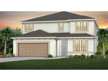 Charming two-story home with a 2-car garage and well-manicured lawn at 1549 Timber Leaf Rd, St Cloud, FL 34771