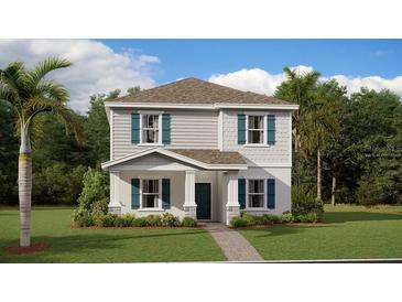 Charming two-story home with teal shutters and lush landscaping at 3005 Namaste Dr, Clermont, FL 34714