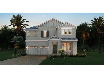 Charming two-story home features a two-car garage and well-manicured landscaping at 11027 Hollow Bay Dr, Winter Garden, FL 34787