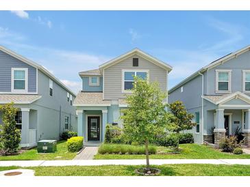 Charming two-story home with a manicured front yard and inviting curb appeal, in a well maintained neighborhood at 11288 Listening Dr, Orlando, FL 32832