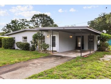 Charming single-story home featuring a covered carport and inviting front yard landscaping at 137 W Lauren Ct, Fern Park, FL 32730