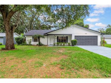 Charming single-story home with a well-manicured lawn and inviting curb appeal at 6505 Dorchester Rd, Lakeland, FL 33809