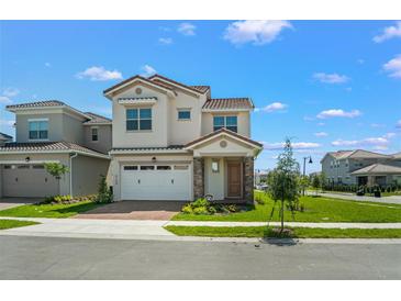 Charming two-story home features a two-car garage, front lawn, and well-manicured landscaping at 8106 Mabury Ln, Orlando, FL 32832