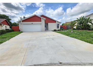 Charming single-Gathering home with a well-maintained lawn and a two-car garage at 11500 Benbow Ct, Orlando, FL 32837