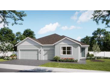 Charming single-story home with a two-car garage, grey exterior, and well-manicured lawn at 737 Fairfields Ln, Deland, FL 32720