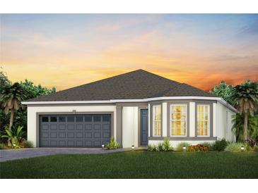 Charming single-Gathering home with a two-car garage, manicured lawn, and colorful landscaping at sunset at 1389 Zesty Citrus Ln, Minneola, FL 34715