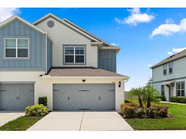 Charming townhome with a two-car garage, well-maintained landscaping, and a beautiful exterior at 3600 Plainview Dr, Orlando, FL 32824