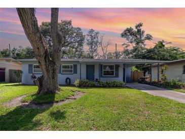 Charming single-story home featuring a well-maintained lawn, mature tree, and inviting curb appeal at 436 Azores Ave, Orlando, FL 32811