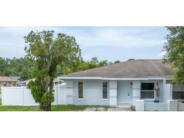 Charming single-story home featuring a freshly painted exterior and a well-maintained front yard at 772 Whippoorwill Dr, Orlando, FL 32825