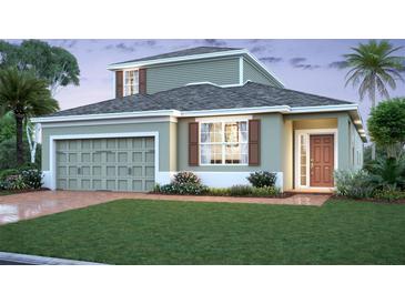 Inviting two-story home featuring a two-car garage and manicured lawn at 2676 Bittern Bnd, St Cloud, FL 34773