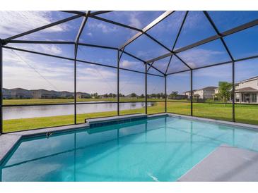 Screened pool with beautiful lake view, perfect for relaxing and entertaining in your private backyard oasis at 3943 Crawley Down Loop, Sanford, FL 32773