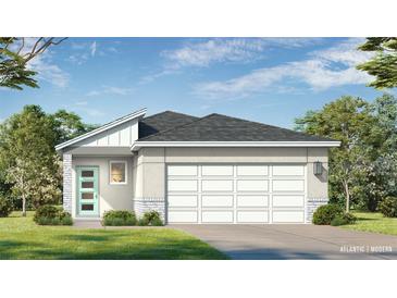Charming single-story home showcasing a modern design with a two-car garage and a well-manicured lawn at 1916 Diamond Head Cir, Lake Hamilton, FL 33851
