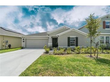 Charming single-Gathering home featuring a well-maintained lawn and inviting curb appeal at 798 Kapi Dr, Groveland, FL 34736