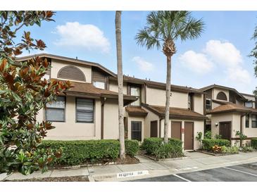 Inviting two-story condo featuring lush landscaping and beautiful curb appeal at 3012 S Semoran Blvd # S, Orlando, FL 32822
