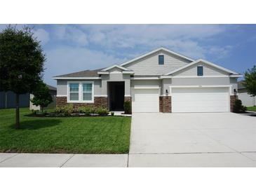 Beautiful single-Gathering home with a well-maintained lawn and a two-car garage at 444 Halter Dr, Apopka, FL 32712