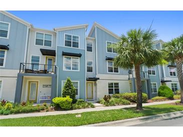 Charming multi-story townhouse with a well-maintained front yard and inviting entrance at 13618 Heaney Ave, Orlando, FL 32827