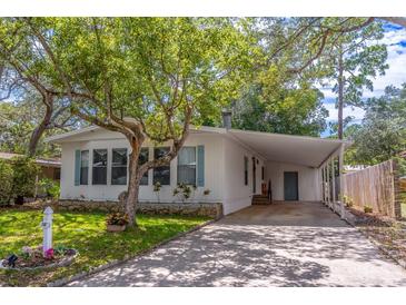 Charming single-story home with a covered carport and well-maintained front yard at 116 E Plantation Blvd, Lake Mary, FL 32746