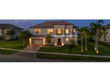 Stunning two-story home with a paved driveway and lush landscaping at 1551 Gateway Ln, Kissimmee, FL 34746
