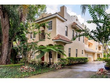 Stunning two-story home featuring lush landscaping and a Spanish-style terracotta tile roof at 820 Ellwood Ave # A, Orlando, FL 32804