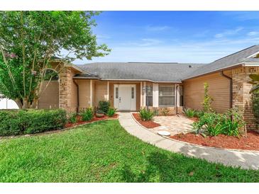 Charming single-Gathering home with a well-maintained front yard and welcoming entrance at 1003 Jackson Creek Ct, Oviedo, FL 32765