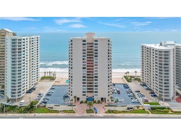Stunning high-rise condo building with ocean views, manicured landscaping, and convenient parking at 2947 S Atlantic Ave # 601, Daytona Beach, FL 32118