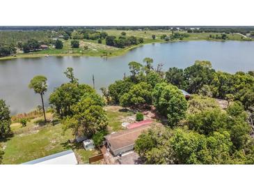 Expansive waterfront property with mature trees and plenty of privacy on a large lake at 2990 E Central Ave, Bartow, FL 33830