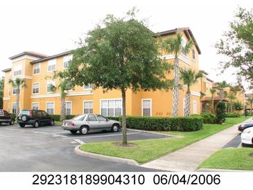 Inviting multi-story building with a beautiful landscape and plenty of parking at 5459 Vineland Rd # 4310, Orlando, FL 32811