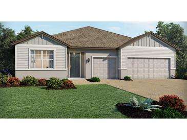 Charming single-story home showcasing well-manicured landscaping and a two-car garage at 3136 Firethorn Cir, Daytona Beach, FL 32124