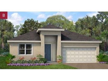 Charming single-story home featuring a two-car garage and landscaped front yard at 1580 Gardiner St, Haines City, FL 33844