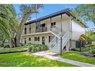 Charming two-story condo with well-maintained landscaping and inviting stairways at 210 Magnolia Rd # 214, Maitland, FL 32751