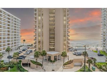 A high-rise condo on the beach with sunset skies, offering ocean views and parking at 3023 S Atlantic Ave # 2050, Daytona Beach, FL 32118