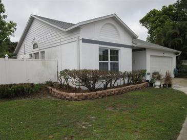 Charming one-story home with a well-manicured lawn and a two-car garage at 362 White Marsh Cir, Orlando, FL 32824