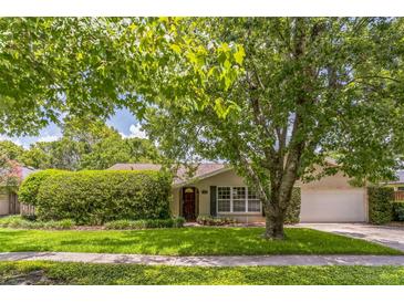 Charming single-story home with a well-manicured lawn, mature tree, and a welcoming curb appeal at 403 Broadview Ave, Altamonte Springs, FL 32701