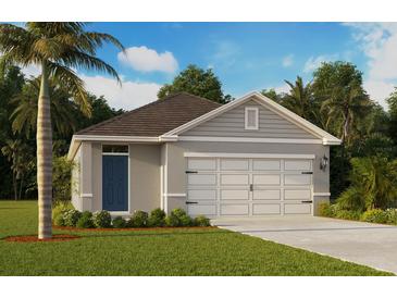 Charming one-story home featuring a two-car garage, manicured lawn, and a blue front door at 5601 Brook Ln, Haines City, FL 33844