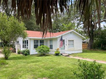 Charming single-story home with a well-manicured lawn and a welcoming front entrance at 578 3Rd St, Daytona Beach, FL 32117