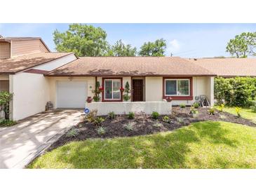 Charming home with a well-maintained front yard and inviting curb appeal at 102 Sand Pine Cir, Sanford, FL 32773