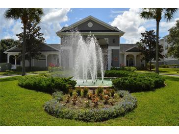 Beautiful apartment complex exterior with landscaping and fountain at 3176 Feltrim Pl # 302, Kissimmee, FL 34747