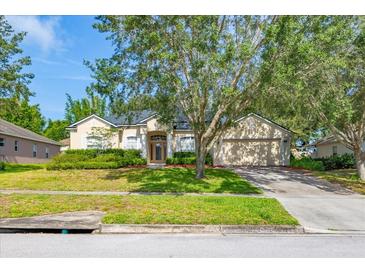 Charming single-story home with lush landscaping and a well-manicured front yard at 3954 Old Dunn Rd, Apopka, FL 32712